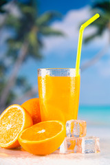 Fresh and cold orange juice served on beach