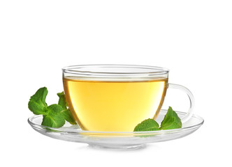 Cup of hot aromatic tea with lemon balm on white background
