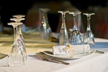 restaurant glass of water on table / dish and spoon