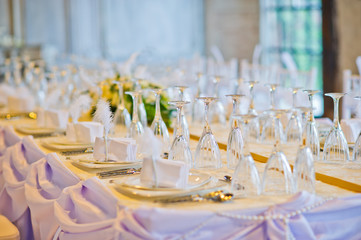 restaurant glass of water on table / dish and spoon