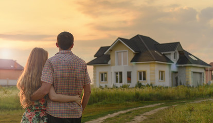 couple looking on house