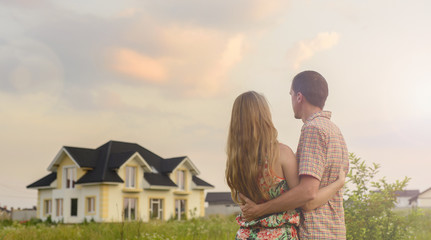 couple looking on house