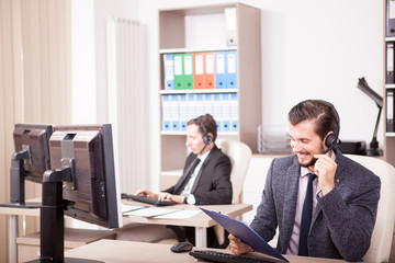 Smiling worker from Customer service support in the office. Professional online and telephone assistant support