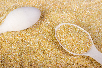 corn grits in the wooden spoon, large depth of field,taken with tilt shift lens