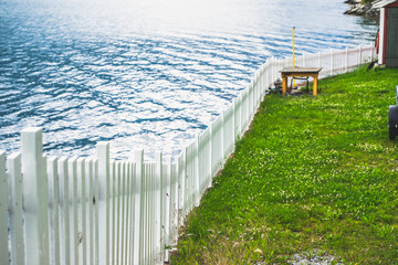 wooden white fence near the sea