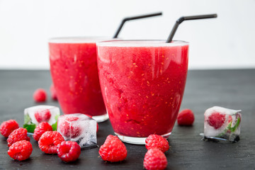 Raspberry ice cold refreshing cocktail with berries