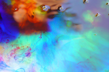 Abstracts Photo with swirling red, blue, and yellow ink