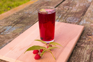 Summer refreshing fruit drink on a wooden table
