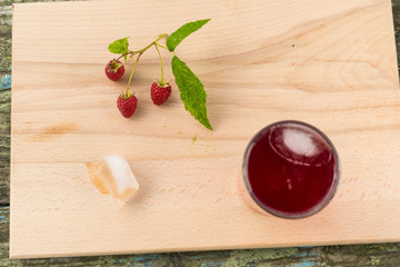 Summer refreshing fruit drink on a wooden table