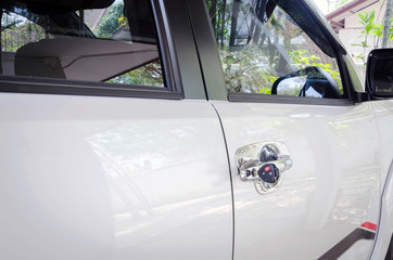 insurance concept, black car key with white car