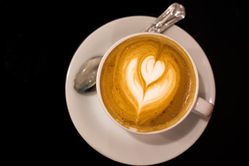Cappuccino on dark table