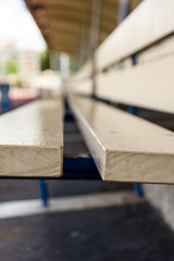 brown bench in stadium