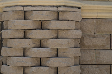 Decorative beige masonry in the style of a sandric