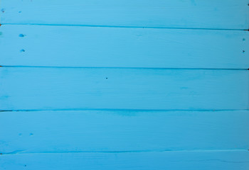 Wooden background. Texture, the surface of the old boards from natural wood with different shades of bright blue, aquamarine, turquoise color. The top view. Close-up. The stock photos.