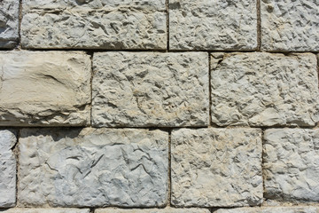 grey brick wall with big stones