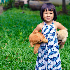 Cute little girl with a bear