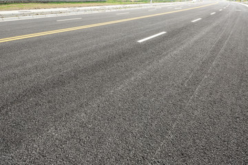 New asphalt road texture background closeup,top view