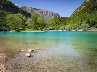 Fototapeta na wymiar Lake Tenno surrounded by Italian alps.