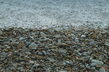 The sea wave rolls to the beach