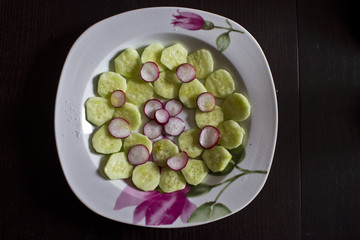 LASTRA A SIGNA - JULY 25 2015: Fresh salad of cucumbers and radish