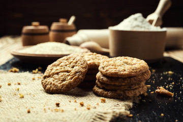 Biscuit sweet cookie background. Domestic stacked butter biscuit pattern concept,close up macro.Homemade cookies on wooden table.Cereal biscuits with the sesame,peanuts,sunflower and amaranth.