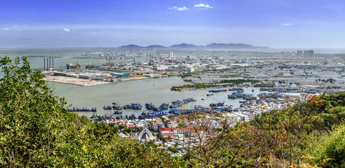 Panoramic view of the vietnamese city Vũng Tàu and industrial zone,  harbor, in a sunny day with clear blue sky
