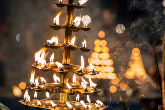 Candles used in performance of religious Ganga Aarti ritual fire puja at  Dashashwamedh Ghat in Varanasi, Uttar Pradesh, India. Stock Photo | Adobe  Stock