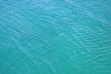 Turquoise blue clean empty sea ocean water surface texture
