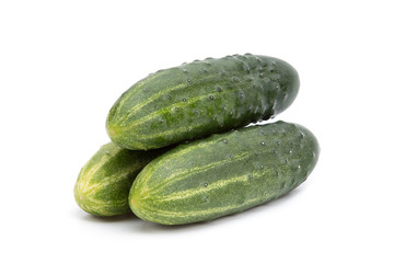 Three cucumbers on a white background