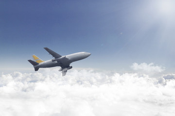 Fototapeta na wymiar Airplane flying over beautiful clouds