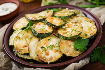 Fried zucchini with sauce, dill and garlic