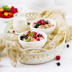 Tasty and healthy oatmeal porridge with berry and flax seeds. Healthy breakfast. Fitness food. Proper nutrition