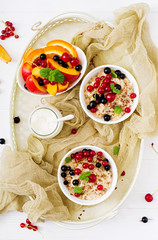 Tasty and healthy oatmeal porridge with berry and flax seeds. Healthy breakfast. Fitness food. Proper nutrition. Flat lay. Top view