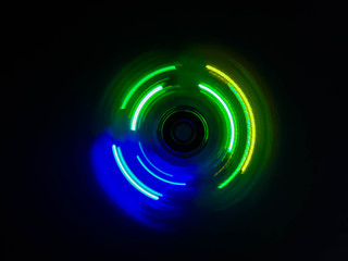 Colorful light neon circle in dark black background