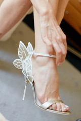 Woman leg in high heel sandal close up