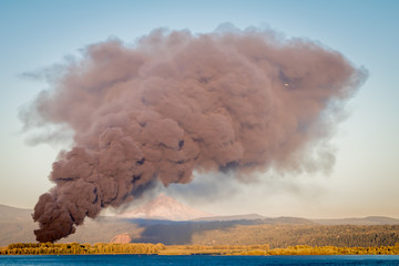 Smoke from industrial fire going over the Columbia River and in front of Mt Hood and Crown Point.