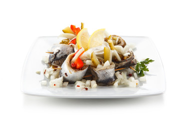 Marinated herring fillets on white background 
