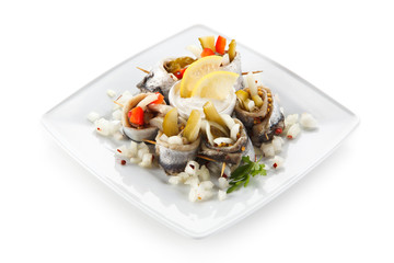 Marinated herring fillets on white background 