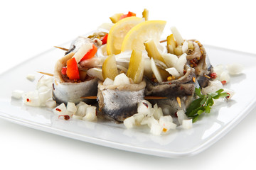 Marinated herring fillets on white background 