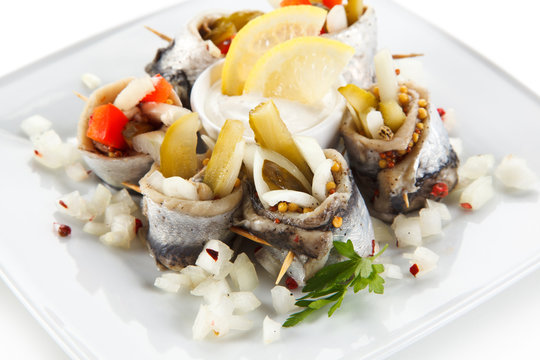 Marinated herring fillets on white background 