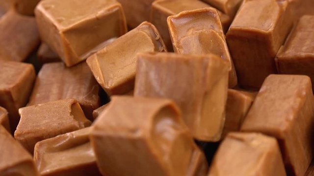 Caramel (rotating on a wooden plate; seamless loopable; 4K)