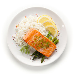 Grilled salmon with french fries on cutting board 