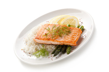Grilled salmon with french fries on cutting board 