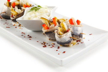 Marinated herring fillets on white background 