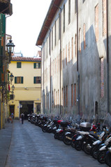Italian motorcycles parked in alley