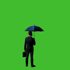 Businessman with umbrella standing over chroma key background. Business, career job concept.