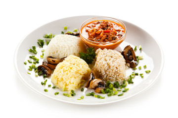 Rice dish with sauce on white background 