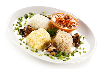 Rice dish with sauce on white background 