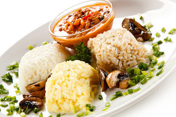 Rice dish with sauce on white background 
