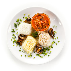 Rice dish with sauce on white background 